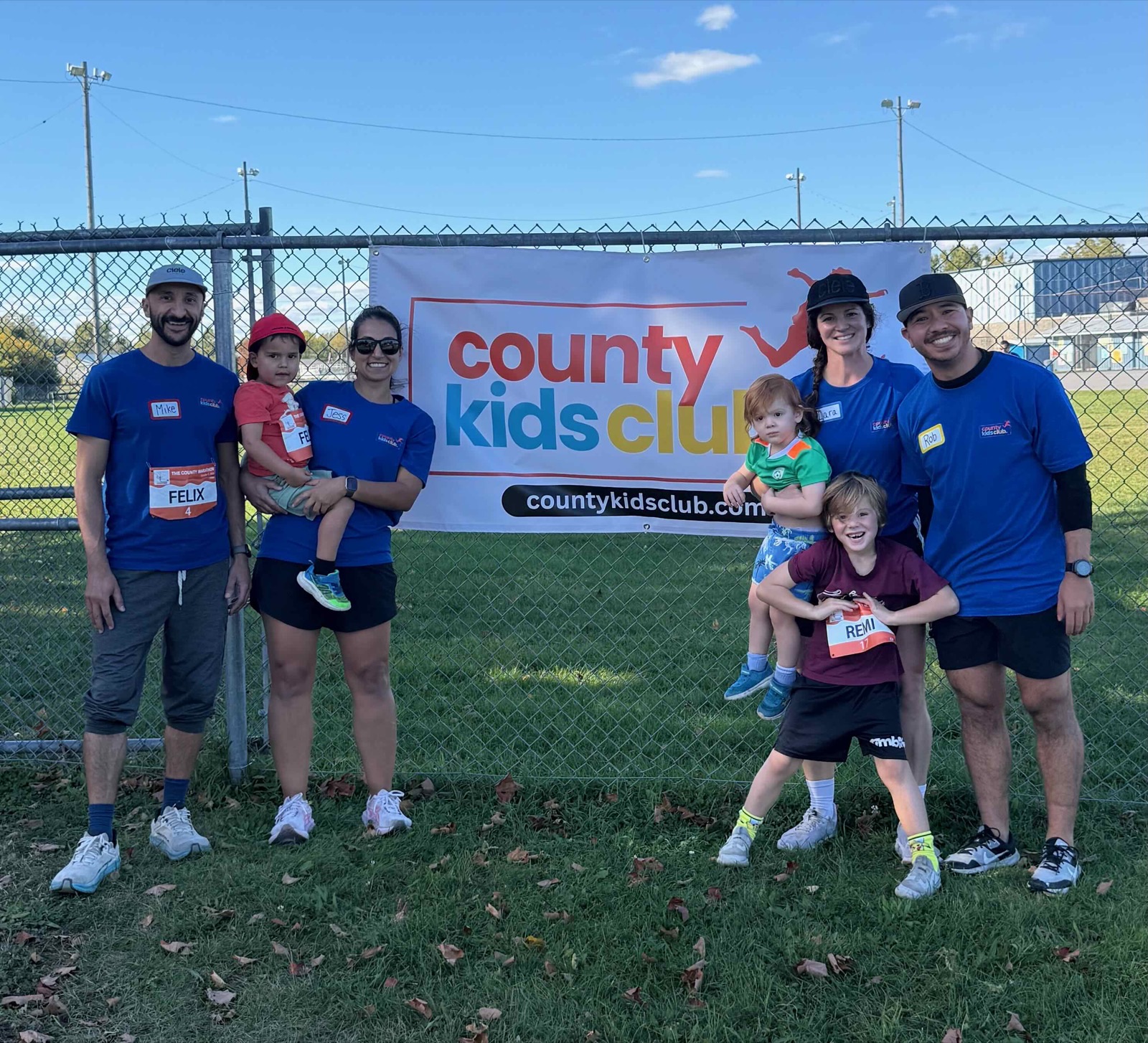 Mike, Jess, Lara, and Rob with their kids at the Kids 1K Run